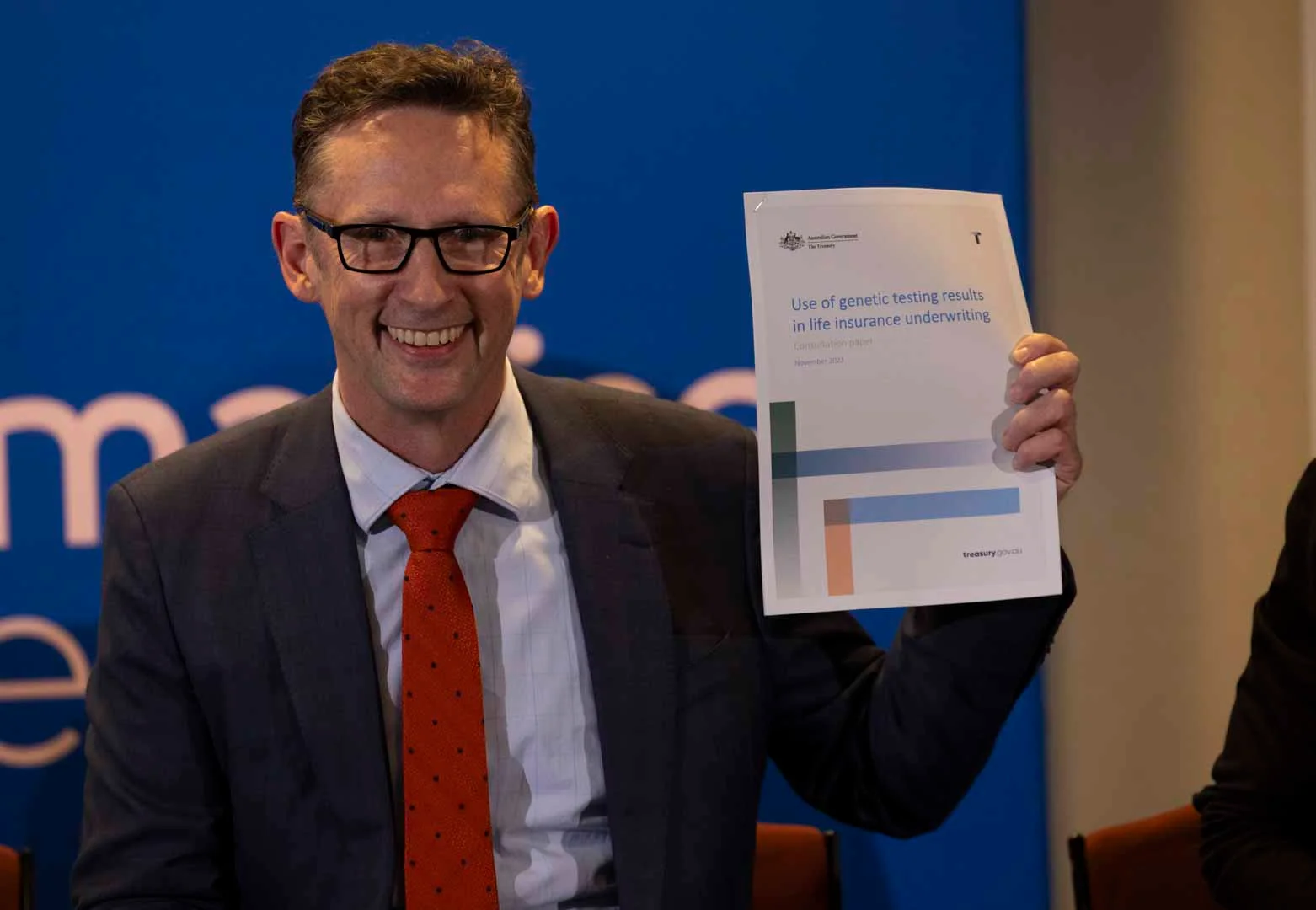 Minister Stephen Jones with Consultation Paper at Humanise Health Event.