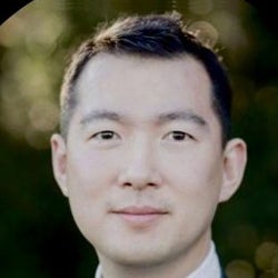 Professional photo of Jason Yu, a man with short brown hair.