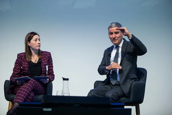 Jonathan Larsen on stage with chair of the session, Annette King.