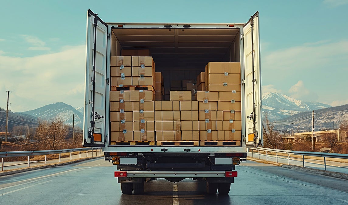 Truck full of parcels on the road