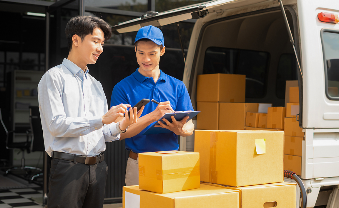 Man talking to rider regarding the packages dropped off.