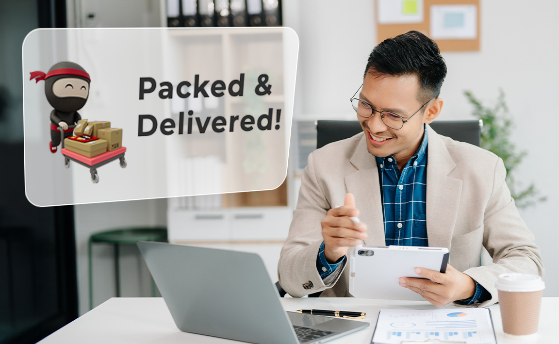 Man smiling at his laptop because he got a notification from Ninja Van that his parcels have packed & delivered.