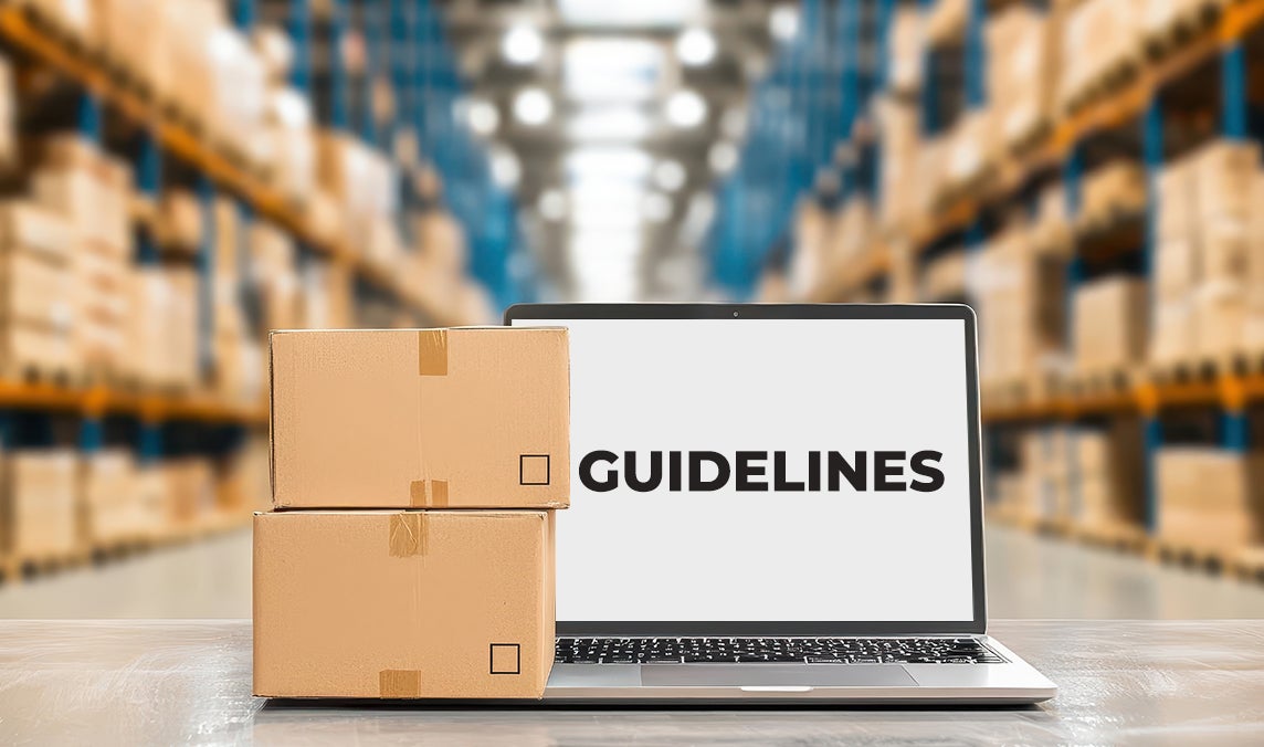 Guidelines on laptop with parcels stacked.