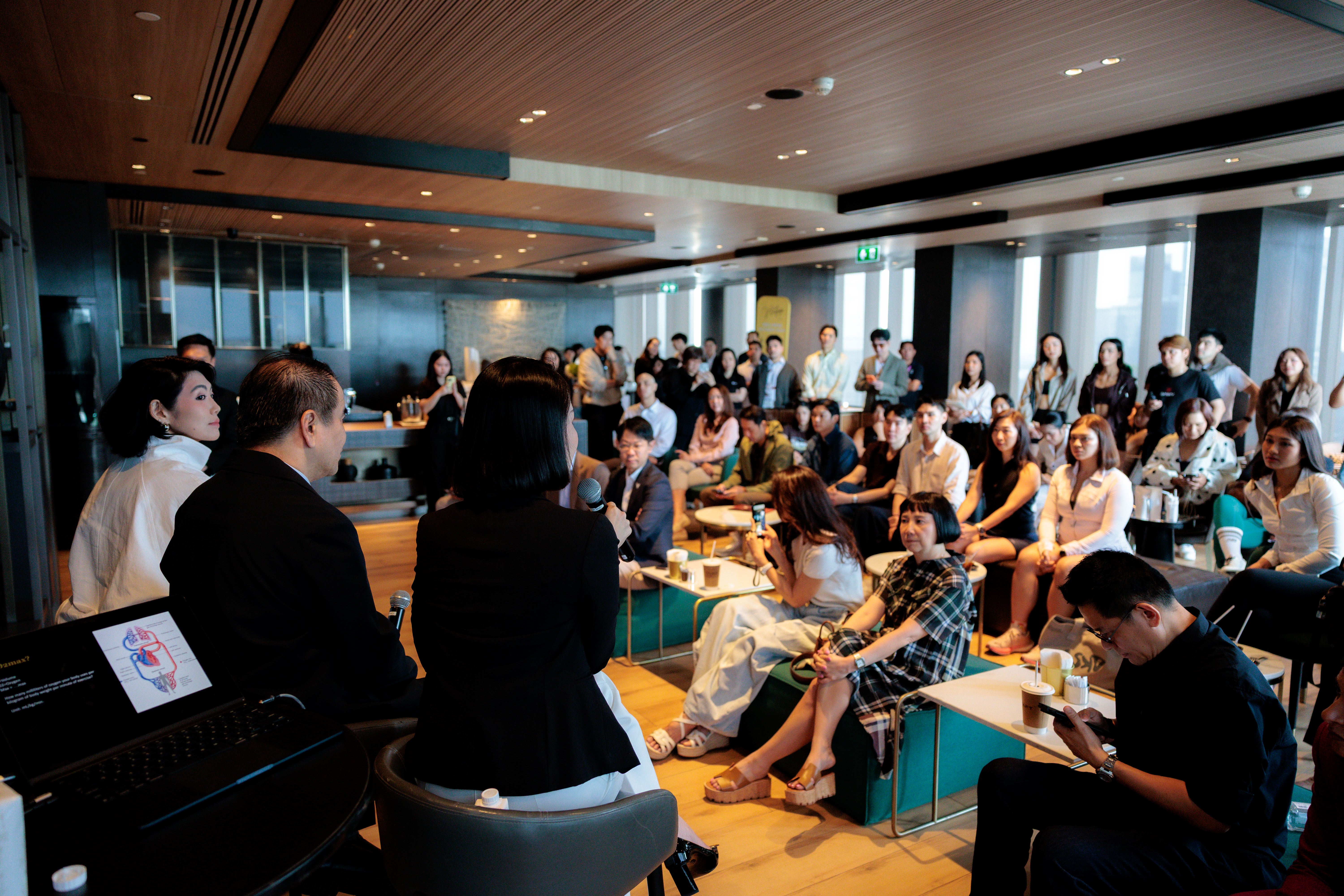 Participants attending a health and performance session for HYROX racers