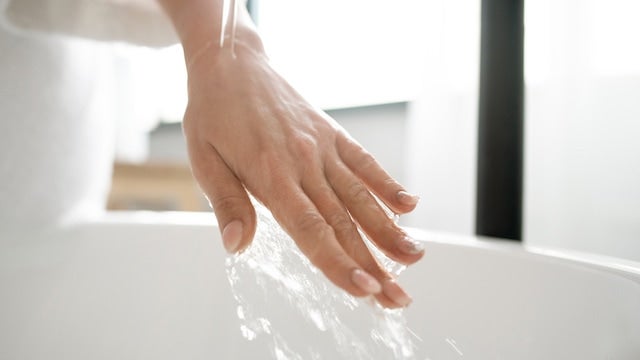 Washing hands in sink