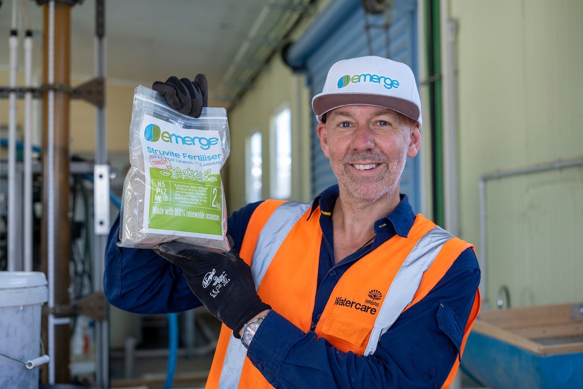 Rob Tinholt of Watercare showing off the Emerge fertilizer product