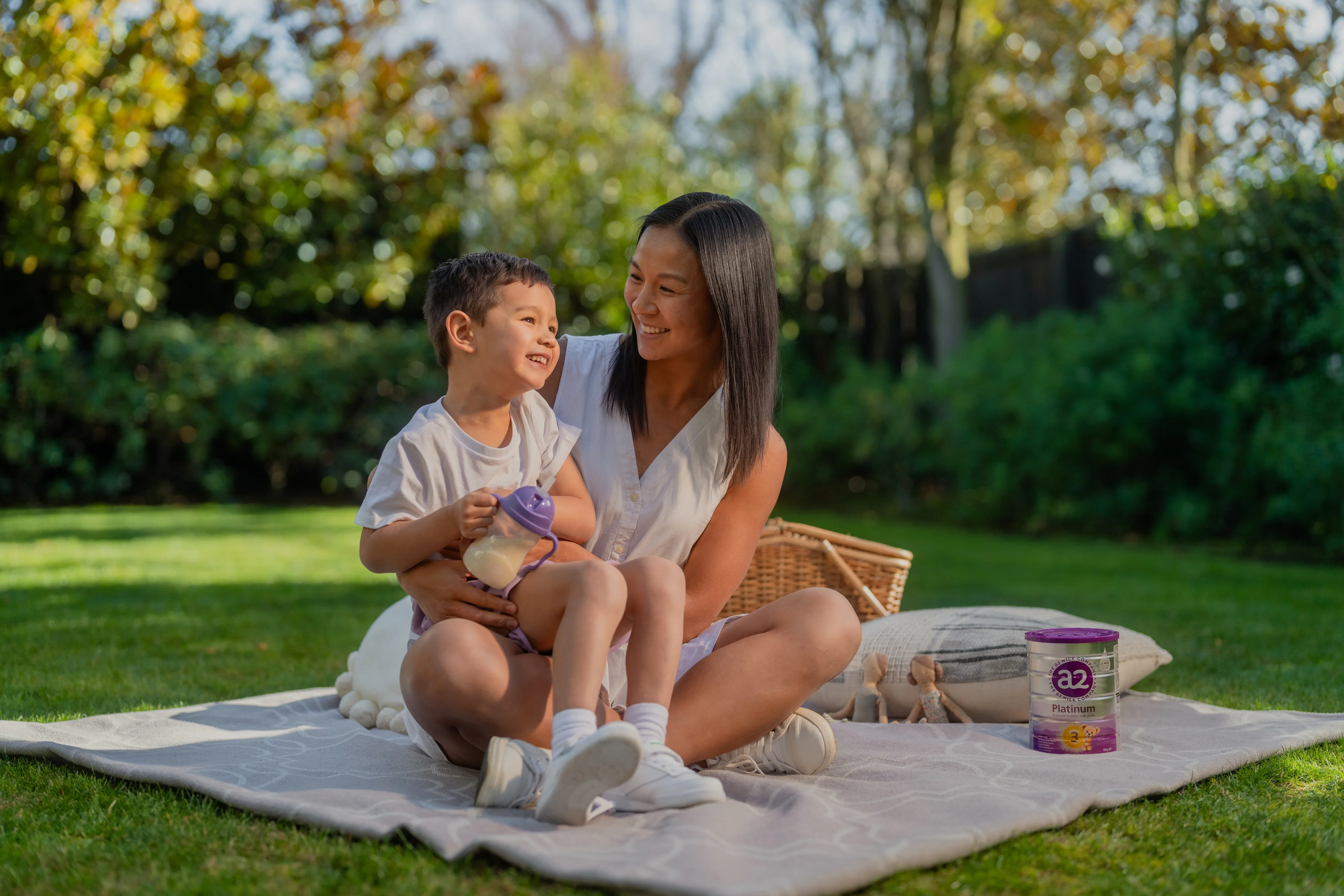 Full a2 Platinum® range and fresh a2 Milk® bottles on picnic table