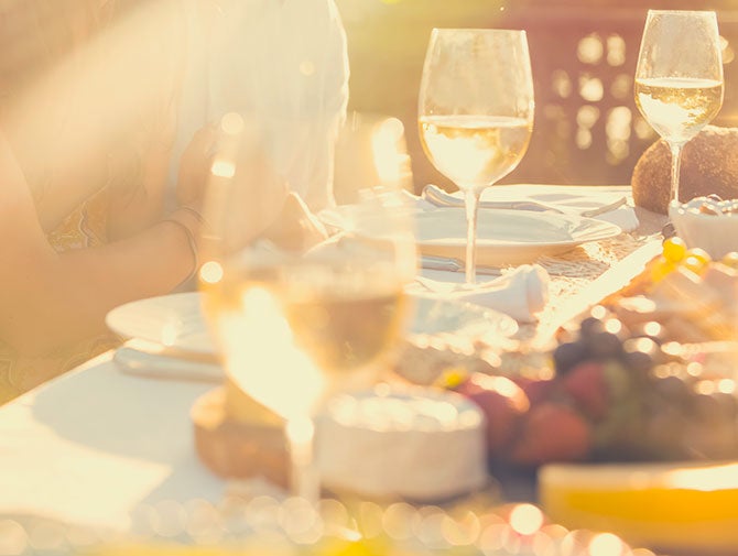 Wine glasses on table with food