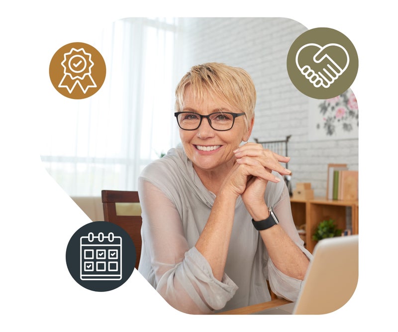 Smiling psychologist working from home on a laptop with supportive icons for flexibility, connection, and clinical excellence
