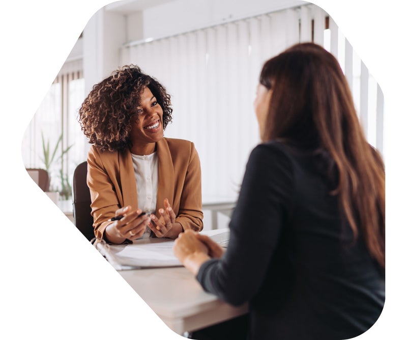 Image of two women GPs discussing what they have learned in My Mirror education session