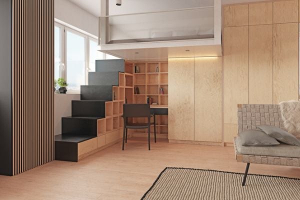 將樓梯間設計為書櫃，並在旁邊設置閱讀桌