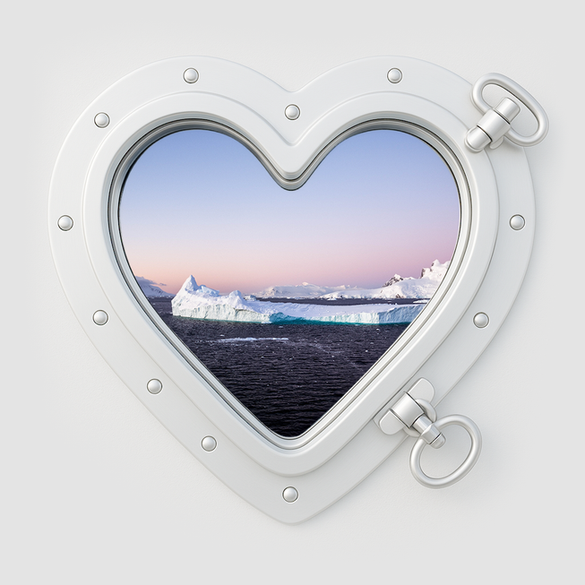 Aurora Expeditions | Looking out through a heart-shaped ships portal onto icebergs | Devotion