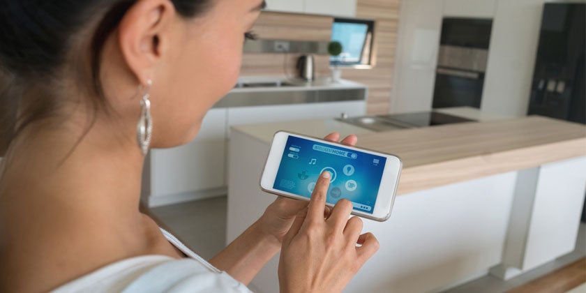 woman using smart control for home