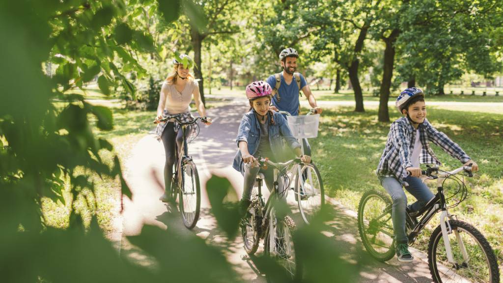Family riding bikes together outdoors