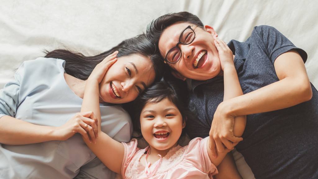 young family playing with child
