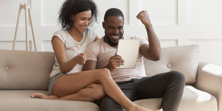 young couple bidding on new home