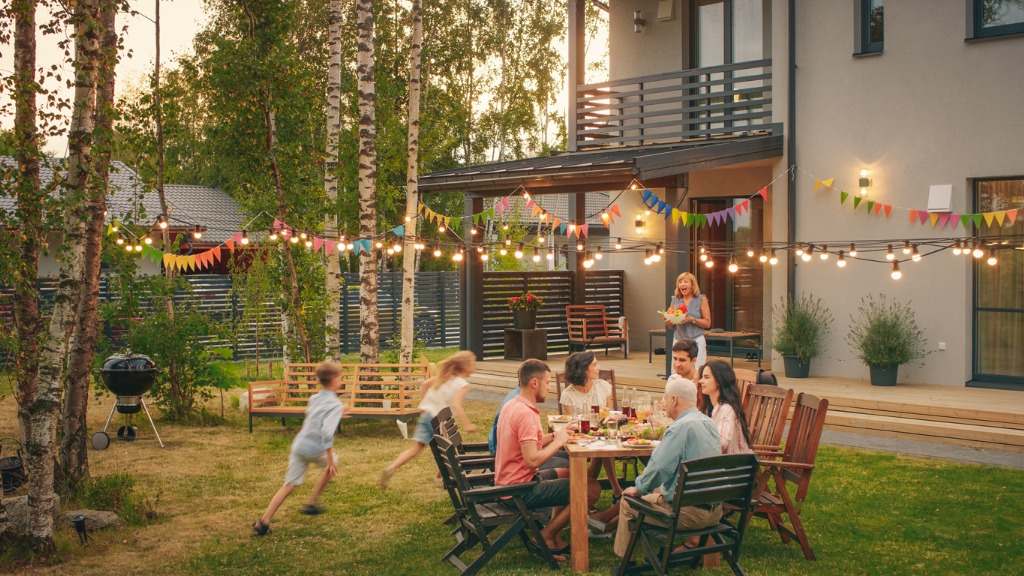 family having outdoor dinner together