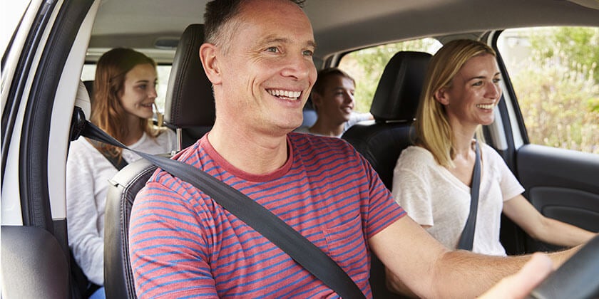 family riding in car
