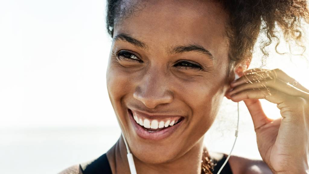 healthy woman jogging with earphones