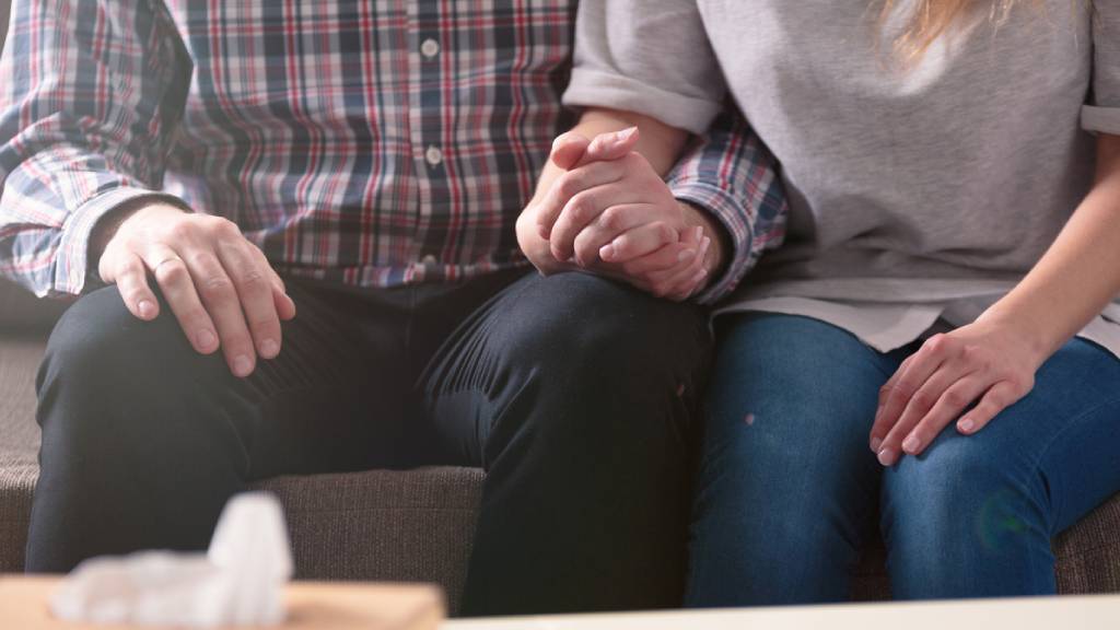 two family members embracing