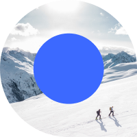 Two people climbing a snowy mountain