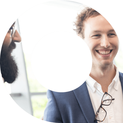 Two actuaries smiling at an event in a viewfinder shape