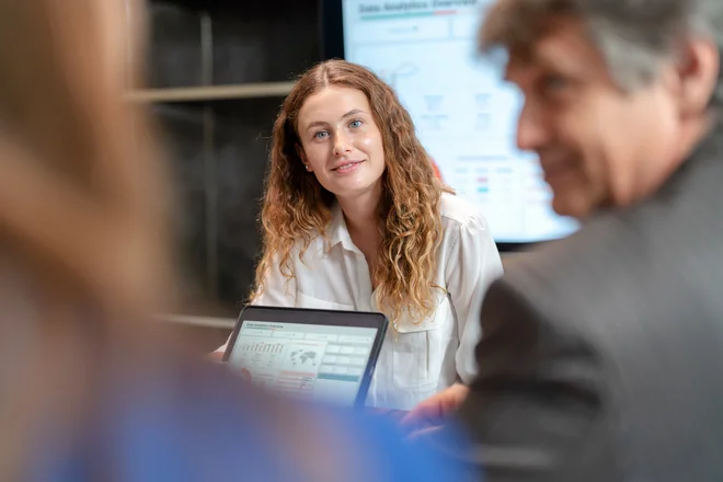 Product launch incentives can take turns for business growth. Businesswoman explain the strategic plan to launch the new product via digital table to sale team in the meeting room at office. Brainstorming and share idea to launch new product to customer.