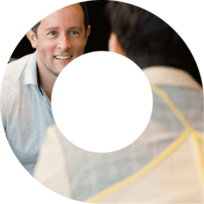 Two actuaries in discussion within viewfinder shape