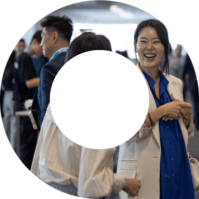 Three actuaries networking at an event. Photo is within a view finder