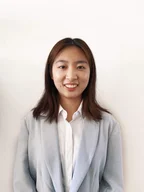 Jessica Zhao - woman stands smiling at camera