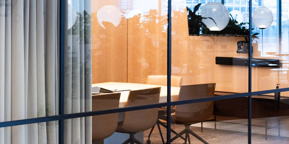 boardroom with chairs and lights in it