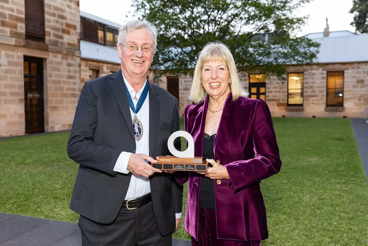 David Whittle, Institute President in 2024, and Jan Swinhoe holding her Actuary of the Year award.