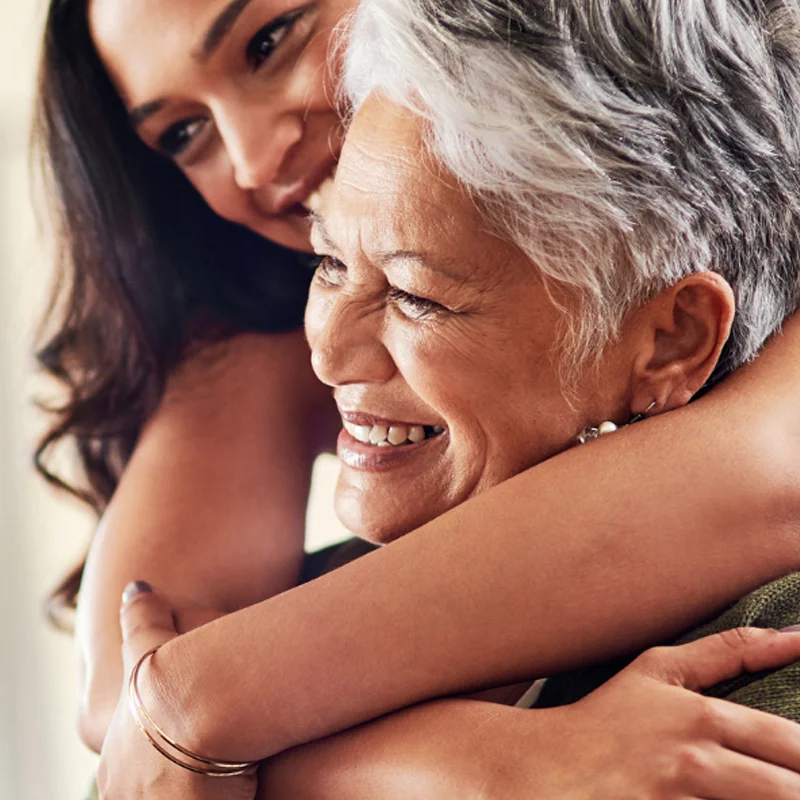 Two women close-up hugging