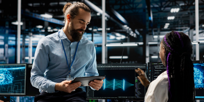 Data centre manager and intern adjusting AI model parameters to upgrade systems