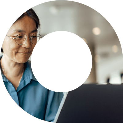 Woman typing on laptop within a viewfinder shape