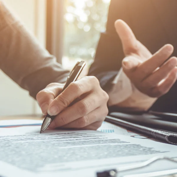 Two hands holding and analysing document
