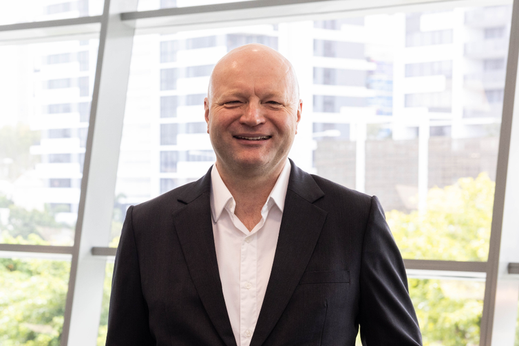 Headshot of educator Colin Priest
