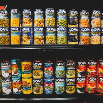 Cans on supermarket shelf