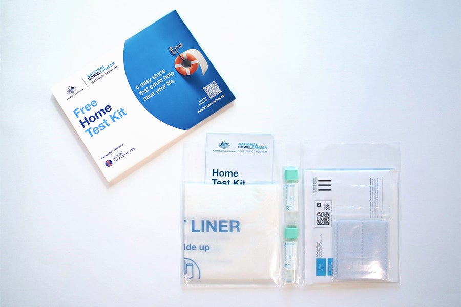 Envelope and contents of bowel screening home test kit.