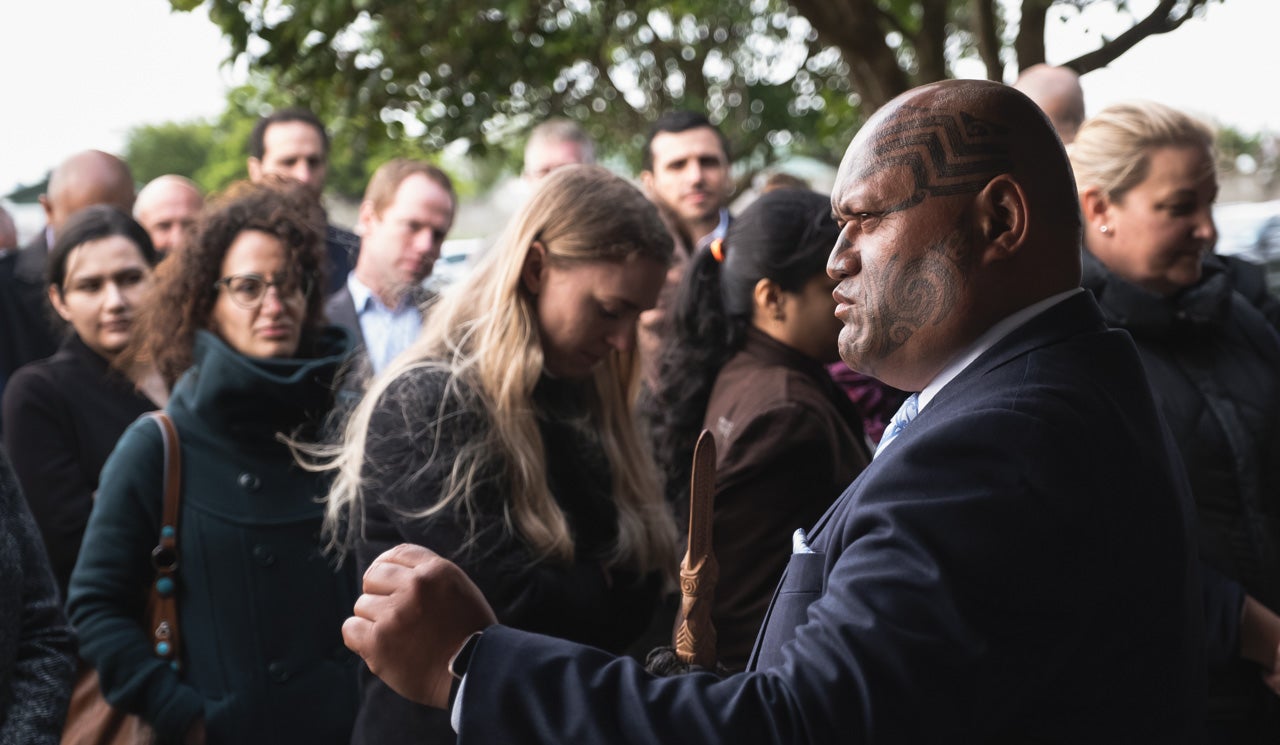 Principal Advisor Richie Waiwai welcomes a procession of stakeholders and Watercare staff onto a marae.