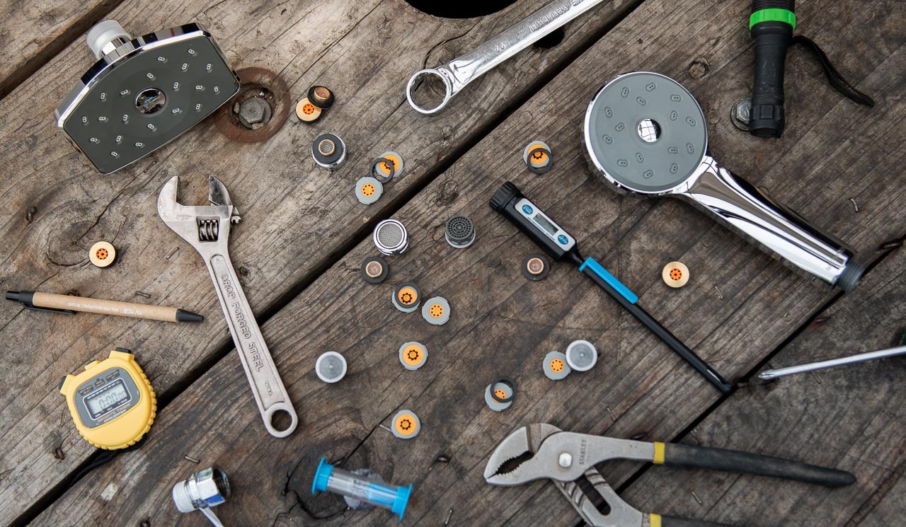 Image of various tools and apparatus used in water flow restriction laid out.