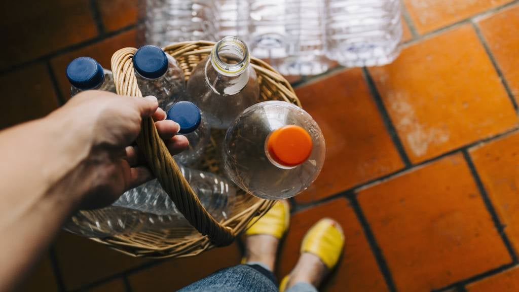Recycling plastic bottles at home.