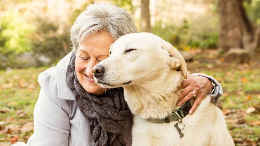 woman hugging dog