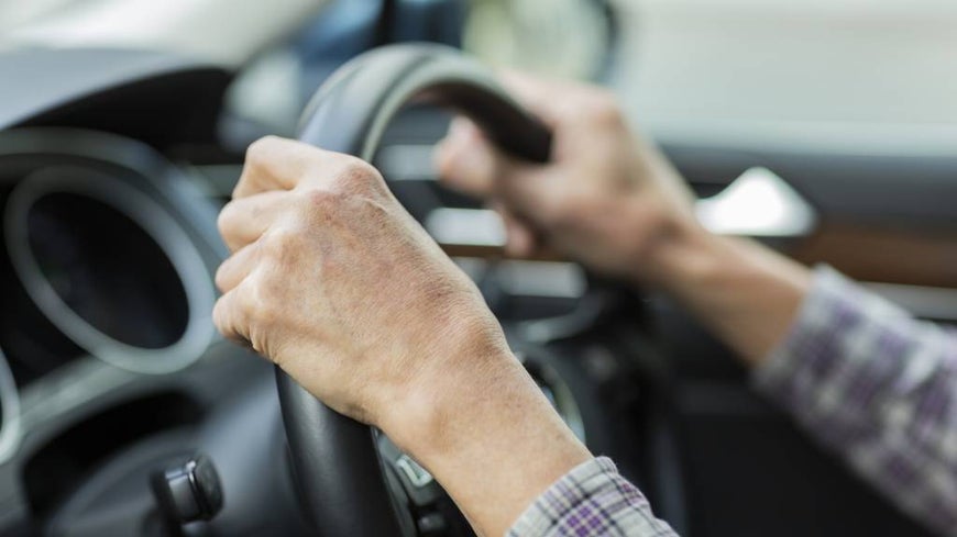 older woman driving car