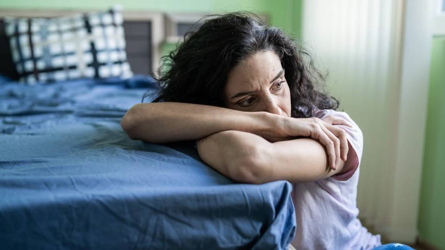 Emotive photo of a woman looking distressed.