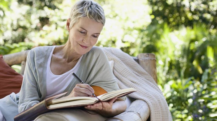 Senior woman writes own eulogy in notebook