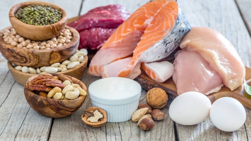 Image of various kinds of proteins, including chicken, salmon, legumes, nuts and meat.