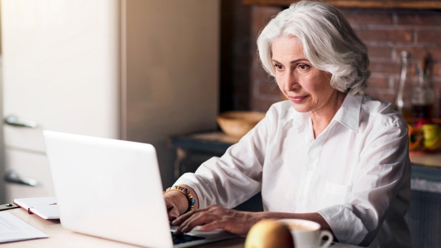 Senior woman writing a eulogy 