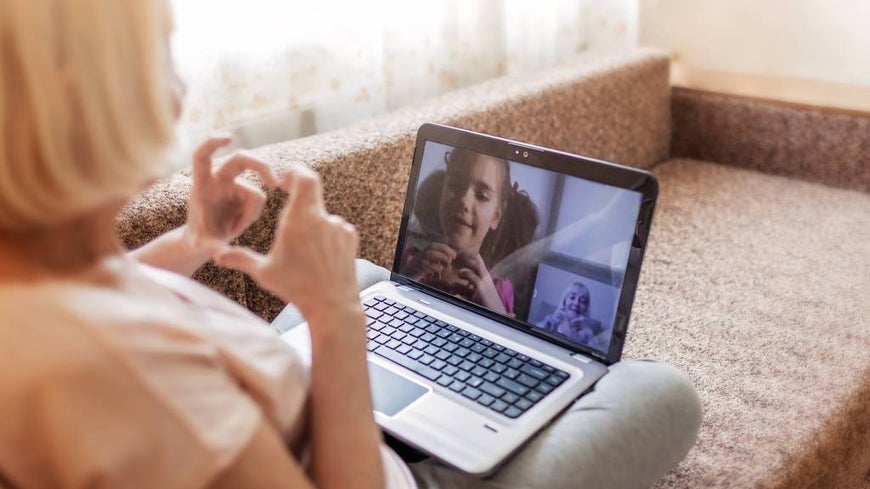 grandmother on video call with granddaughter 