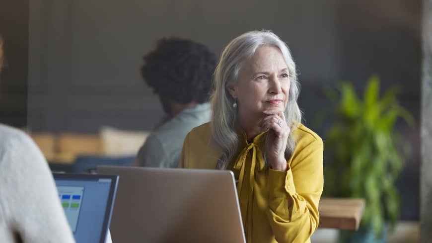 Mature woman in front of her computer in office setting